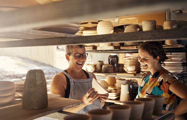 Two people in a pottery studio